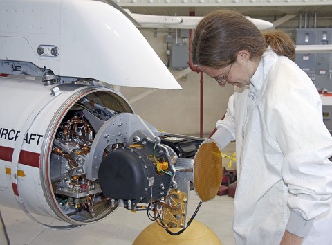 Hannah Goldberg, a NASA JPL engineer on the MSL field test team, checks out the MSL radar in the Quick Test Experimental Pod on NASA Dryden's F/A-18 aircraft. (NASA / Carla Thomas) 