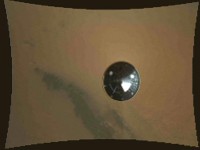 This color thumbnail image was obtained by NASA’s Curiosity rover during its descent to the surface of Mars on Aug. 5th PDT (Aug. 6th EDT). The image was obtained by the Mars Descent Imager instrument known as MARDI and shows the 15-foot (4.5-meter) diameter heat shield when it was about 50 feet (16 meters) from the spacecraft. (Image credit: NASA/JPL-Caltech)