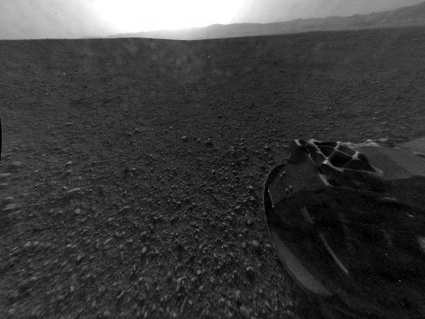 This is the full-resolution version of one of the first images taken by a rear Hazard-Avoidance camera on NASA's Curiosity rover, which landed on Mars the evening of Aug. 5 PDT (morning of Aug. 6 EDT). The image was originally taken through the "fisheye" wide-angle lens, but has been "linearized" so that the horizon looks flat rather than curved. The image has also been cropped. A Hazard-avoidance camera on the rear-left side of Curiosity obtained this image. (Image credit: NASA/JPL-Caltech)