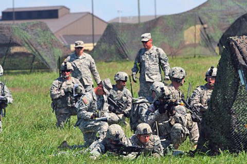 Soldiers from 2nd Battalion, 506th Infantry Regiment and 4th Battalion, 320th Field Artillery Regiment, 4th Brigade Combat Team, 101st Airborne Division, conduct walk-and-shoot rehearsals on Son Drop Zone, Aug. 28, 2012 at Fort Campbell, Ky. The walk-and-shoot rehearsals are designed to provide an additional iteration for company, battery, and troop leadership with an opportunity to exercise and refine their capability to call for fire and request close combat aircraft prior to a live fire exercise. (U.S. Army photo by Staff Sgt. Todd A. Christopherson, 4th Brigade Combat Team Public Affairs)