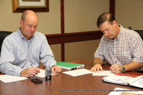 Montgomery County Attorney Austin Peay VII  and J. Lee Powell sign the paperwork transferring ownership of the property on September 7th, 2012