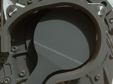 This image from NASA's Curiosity rover shows the cover on an inlet that will receive powdered rock and soil samples for analysis. (Image credit: NASA/JPL-Caltech/MSSS) This image from NASA's Curiosity rover shows the cover on an inlet that will receive powdered rock and soil samples for analysis. (Image credit: NASA/JPL-Caltech/MSSS)