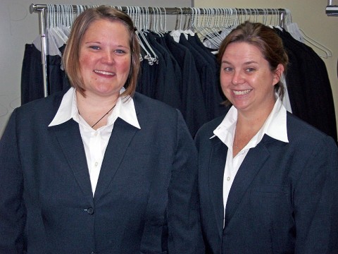 (L-R) Sabrina Wallace and Anna Collins posed showing off the suits they tried on when getting fitted for their very own new suits. (Photo by Lois Jones)