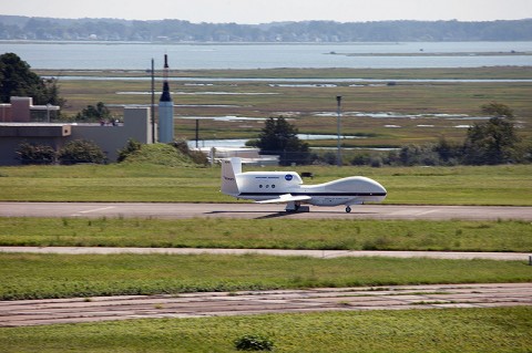 An unmanned NASA Global Hawk aircraft comes in for a landing at NASA's Wallops Flight Facility on Wallops Island, VA, Sept. 7, kicking off the month-long Hurricane and Severe Storm Sentinel (HS3) mission. HS3 will help researchers and forecasters uncover information about how hurricances and tropical storms form and intensify. (Image credit: NASA)