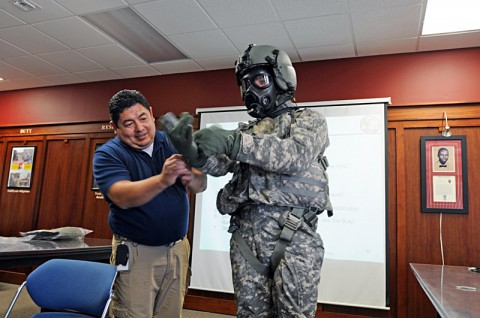 Bobbie Salazar, a Personal Protective Equipment Team member, helps Chief Warrant Officer 2 Nathan Smith, a pilot with Troop A, 7th Squadron, 17th Cavalry Regiment, 159th Combat Aviation Brigade, don the Joint Protective Aircrew Ensemble, designed specifically for aviators. The 159th CAB is the first stateside Army unit to field the JPACE. (Photo by Capt. Xeriqua Garfinkel)