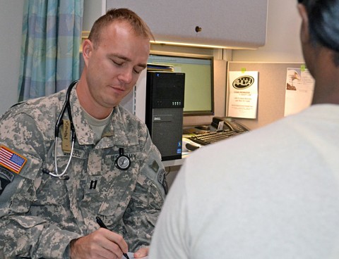 Capt. Jonathan Strobel, the brigade surgeon for 159th Combat Aviation Brigade, makes notes during a patient appointment Friday at Fort Campbell, Ky. Medical providers and unit commanders are working together to decrease the number of medically non-deployable Soldiers by 2013. (U.S. Army photo by Spc. Jennifer Andersson, 159th Combat Aviation Brigade Public Affairs)