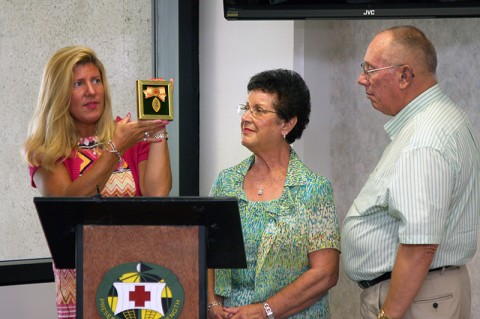 Col. Florence A. Blanchfield's great-great-niece, Tammi Desimone, donates the originial Florence Nightingale medal awarded to Blanchfield by the International Red Cross. Desimone and her parents, Walter "Junior" and Sadie Blanchfield, visited the Blanchfield Army Community Hospital in Fort Campbell, Ky. Sept. 4, 2012 to help celebrate the hospital's 30th anniversary. 