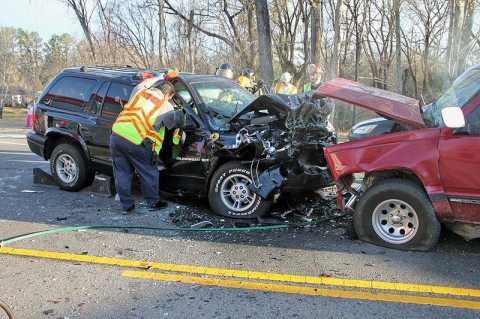 Emergency personel looking over the wreckage. (Photo by CPD-Jim Knoll)