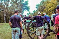 Officers and senior enlisted with 1st Battalion, 502nd Infantry Regiment, 2nd Brigade Combat Team, 101st Airborne Division (Air Assault), gather around a cannon used during the civil war by the confederates defending Fort Donelson, September 28th. The cannons were used with other defense techniques to keep the encroaching Union soldiers at bay.