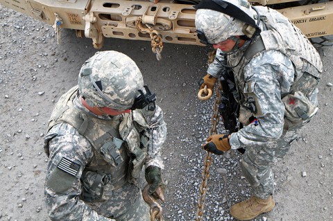 Soldiers from 4th Brigade Special Troops Battalion, 4th Brigade Combat Team, 101st Airborne Division, conduct a hasty recovery on a disabled vehicle during a convoy live-fire exercise, Oct. 13th, 2012, as part of the brigade’s field exercise, Eagle Flight III at Fort Campbell, KY. (Photo by Staff Sgt. Todd Christopherson)