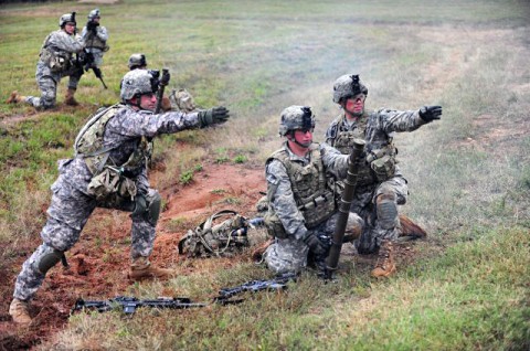 A 60mm mortar system mortar crew with Company D, 2nd Battalion, 506th Infantry Regiment, 4th Brigade Combat Team, 101st Airborne Division, receive firing directions from their mortar squad leader during the walk-and-shoot exercise of Eagle Flight III on Sept. 28, 2012 at Fort Campbell, Ky. (U.S. Army Photo by Staff Sgt. Todd A. Christopherson, 4th Brigade Combat Team Public Affairs)