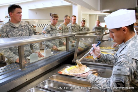 Soldiers of the 2nd Brigade Combat Team pass through the meal line