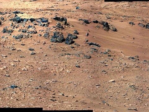 This patch of windblown sand and dust downhill from a cluster of dark rocks is the "Rocknest" site, which has been selected as the likely location for first use of the scoop on the arm of NASA's Mars rover Curiosity. (Image credit: NASA/JPL-Caltech/MSSS)