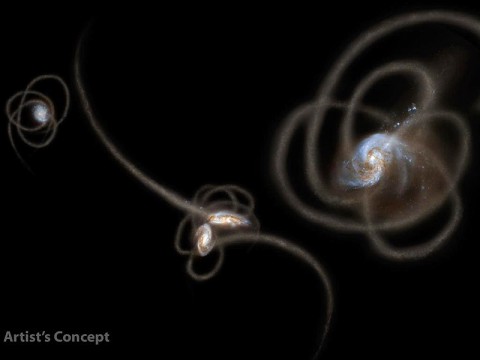 New research from scientists using NASA's Spitzer Space Telescope suggests that a mysterious infrared glow across our whole sky is coming from stray stars torn from galaxies. When galaxies grow, they merge and become gravitationally tangled in a violent process that results in streams of stars being ripped away from the galaxies. Such streams, called tidal tails, can be seen in this artist's concept. Scientists say that Spitzer is picking up the collective glow of stars such as these, which linger in the spaces between galaxies. (Image credit: NASA/JPL-Caltech/UC Irvine) New research from scientists using NASA's Spitzer Space Telescope suggests that a mysterious infrared glow across our whole sky is coming from stray stars torn from galaxies. When galaxies grow, they merge and become gravitationally tangled in a violent process that results in streams of stars being ripped away from the galaxies. Such streams, called tidal tails, can be seen in this artist's concept. Scientists say that Spitzer is picking up the collective glow of stars such as these, which linger in the spaces between galaxies. (Image credit: NASA/JPL-Caltech/UC Irvine)