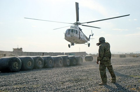 U.S. Army Sgt. Joshua Keller, who hails from Louisville, Ky., a Helicopter landing zone non-commissioned officer in charge from Headquarters Company, 626th Brigade Support Battalion, 3rd Brigade Combat Team “Rakkasans,” 101st Airborne Division (Air Assault), awaits as a civilian contacted air asset helicopter approaches for a sling load of supplies at Forward Operating Base Salerno, Nov. 5, 2012. (U.S. Army photo by Sgt. 1st Class Abram Pinnington, TF 3/101 Public Affairs)