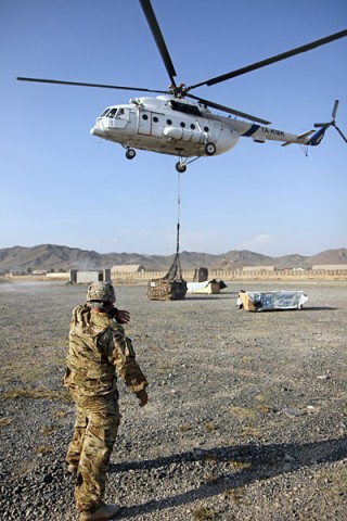 U.S. Army Spc. Pete Sigala, who hails from Anaheim, Calif., a helicopter landing zone sling load specialist from Headquarters Company, 626th Brigade Support Battalion, 3rd Brigade Combat Team “Rakkasans,” 101st Airborne Division (Air Assault), double checks the sling load from attached to a civilian contacted air asset helicopter after successfully hooking up a load of supplies at Forward Operating Base Salerno, Nov. 5, 2012. (U.S. Army photo by Sgt. 1st Class Abram Pinnington, TF 3/101 Public Affairs)