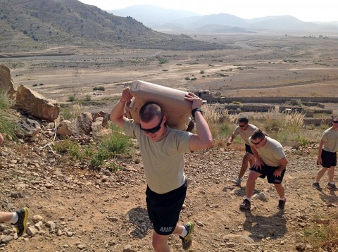 U.S. Army Soldiers from Headquarters Platoon, Company A, 3rd Battalion,187th Infantry Regiment, 3rd Brigade Combat Team “Rakkasans,” 101st Airborne Division (Air Assault), sprint to the top of an observation point carrying forty-five pound water jugs at Combat Outpost Chergotaw, Nov. 1st, 2012. The Angel Rak Competition is a test that identifies the strongest and most physically fit squads in the Company. (U.S. Army photo by Capt. Erik Alfsen, 3-187th Chaplain)