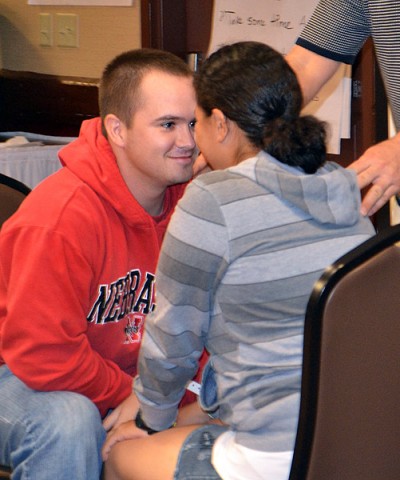 Sgt. Jory Long (left), a network switching systems operator maintainer with Company C, 563rd Aviation Support Battalion, 159th Combat Aviation Brigade, and his wife, Spc. Evelin Long, an information systems operator-analyst with Headquarters Support Company, 563rd ASB, demonstrate proper techniques for effective communication during a Strong Bonds marriage retreat in Sevierville, TN, Oct. 27. (U.S. Army photo by Spc. Jennifer Andersson)