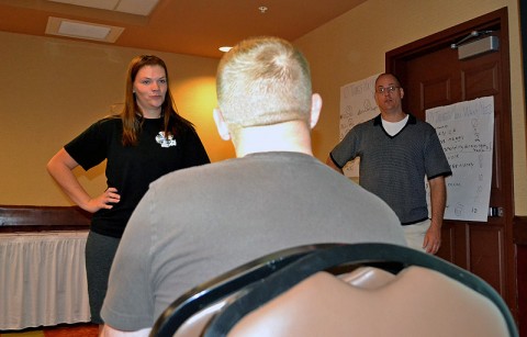 Amanda Tiller (left) role-plays with her husband, Sgt. Michael Tiller, a CH-47 Chinook helicopter mechanic with Company B, 563rd Aviation Support Battalion, 159th Combat Aviation Brigade, to illustrate proper techniques for better communication during a Strong Bonds marriage retreat in Sevierville, TN, Oct. 27. The retreats offered to all Soldiers and families of the 159th CAB teach techniques to fortify their home lives and build trust and teamwork. (U.S. Army photo by Spc. Jennifer Andersson)