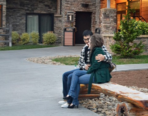 Sgt. Michael Retoff, the operations noncommissioned officer-in-charge with Company C, 563rd Aviation Support Battalion, 159th Combat Aviation Brigade, tries to keep his wife, Heather, warm while waiting for a shuttle during a Strong Bonds marriage retreat in Sevierville, TN, Oct. 27. The retreats are intended to teach proper techniques for better communication within relationships between soldiers and their families, as well as fortify their home lives and build trust and teamwork. (U.S. Army photo by Spc. Jennifer Andersson)