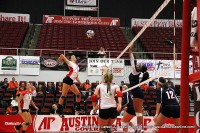 APSU’s Lauren Henderson goes up to hit one of her 13 kills against the UT Martin Skyhawks.