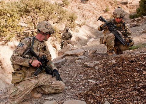 U.S. Army Spc. Erik Nantz (left), a medic, and U.S. Army Staff Sgt. Ronald Dekker (right), a section leader, both attached to Blue Platoon, Troop B, 1st Squadron, 33rd Calvary Regiment, 3rd Brigade Combat Team, 101st Airborne Division (Air Assault), inspect a possible weapon cache site in Shamal District, Oct. 26, 2012. Troop B conducted route reconnaissance and looked for weapons caches and improvised explosive devices. (U.S Army photo by Sgt. Christopher Bonebrake, 115th Mobile Public Affairs Detachment)