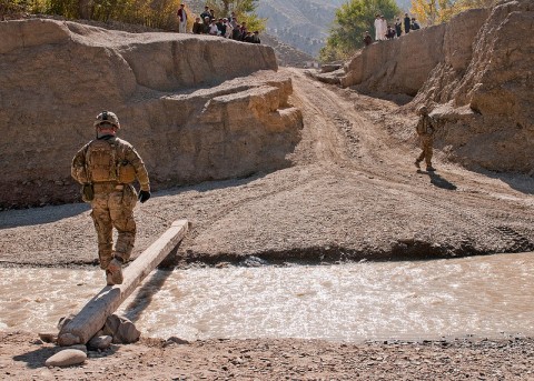 A U.S. Army Soldier from Troop B, 1st Squadron, 33rd Calvary Regiment, 3rd Brigade Combat Team, 101st Airborne Division (Air Assault), crosses a river into a village in Shamal District, Oct. 26, 2012. Troop B conducted a route reconnaissance to prepare for future operations in the area. (U.S Army photo by Sgt. Christopher Bonebrake, 115th Mobile Public Affairs Detachment)