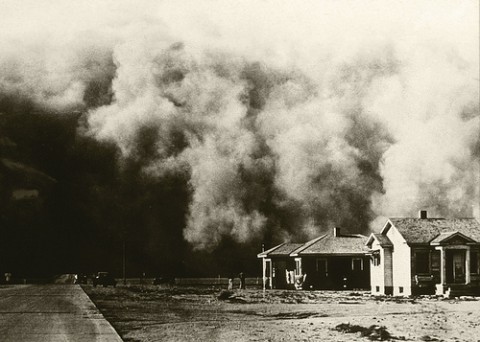 A huge dust storm moves across the land during the Dust Bowl of the 1930s.