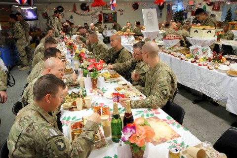 Soldiers assigned to Camp Clark, Afghanistan enjoy a large Christmas lunch on Christmas Day. The dining facility maximized every effort to ensure the Soldiers experienced the best dining expeience possible while deployed away from their familes during the holiday season. (U.S. Army photo by Sgt. 1st Class Abram Pinnington, TF 3/101 Public Affairs) 