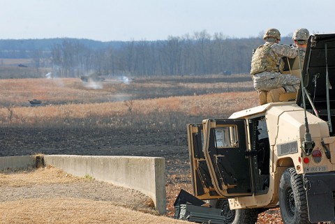 Soldiers assigned to the 3rd Brigade Combat Team "Rakkasans," 101st Airborne Division engage targets from atop a tactical vehicle with a MK 19 grenade machine gun Nov. 26 at Fort Campbell, Ky. The range gives Soldiers the opportunity to familiarize themselves with the weapon system for Individual Readiness Training in preparation for a deployment to Afghanistan. (U.S. Army photo taken by Sgt. Alan Graziano, 3rd Brigade Combat Team, 101st Airborne Division)