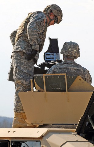 A range safety noncommissioned-officer of the MK 19 grenade machine gun range ensures that a Soldier has properly cleared the weapon system after firing Nov. 26 at Fort Campbell, Ky. The exercise gives Soldiers the opportunity to familiarize themselves with the weapon system for Individual Readiness Training in preparation for a deployment to Afghanistan. (U.S. Army photo taken by Sgt. Alan Graziano, 3rd Brigade Combat Team, 101st Airborne Division)