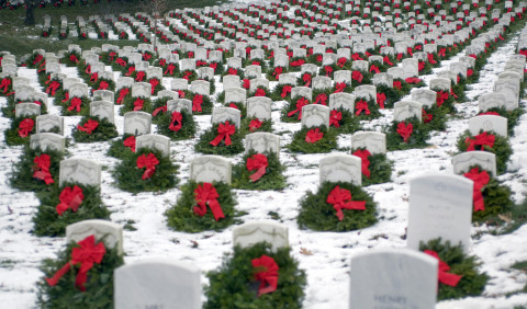 The 14th annual wreath laying event is a result of Harrington, Maine, based Worcester Wreath Company owner Morrill Worcester's boyhood dream of doing something to honor those laid to rest in the national cemetery. (Master Sgt. Jim Varhegyi/U.S. Air Force)