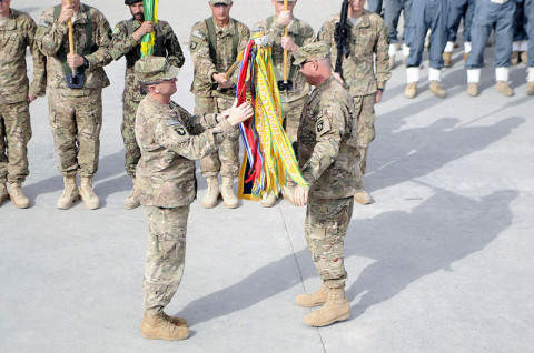 Col. J.P. McGee and Command Sgt. Maj. Thomas W. Eppler, the commander and command sergeant major of the 1st Brigade Combat Team, 101st Airborne Division, uncase the brigade colors December 5th during the Transfer of Authority ceremony from 4th BCT, 4th Infantry Division to the 201st Afghan National Army Corps here. (U.S. Army photo by Sgt. Jon Heinrich, Taskforce 1-101 PAO) Col. J.P. McGee and Command Sgt. Maj. Thomas W. Eppler, the commander and command sergeant major of the 1st Brigade Combat Team, 101st Airborne Division, uncase the brigade colors December 5th during the Transfer of Authority ceremony from 4th BCT, 4th Infantry Division to the 201st Afghan National Army Corps here. (U.S. Army photo by Sgt. Jon Heinrich, Taskforce 1-101 PAO)