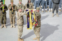 Col. J.P. McGee and Command Sgt. Maj. Thomas W. Eppler, the commander and command sergeant major of the 1st Brigade Combat Team, 101st Airborne Division, uncase the regimental colors December 5th during the transfer of authority ceremony from 4th Brigade Combat Team, 4th Infantry Division, to the 201st Afghan National Army Corps at Forward Operating Base Fenty, Afghanistan. (U.S. Army photo by Sgt. Jon Heinrich, Task Force 1-101 PAO)