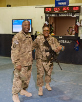 Master Sgt. Lemuel Wynn, Headquarters Support Company, 96th Aviation Support Battalion operations non-commissioned officer in charge picks up his wife, Sgt. 1st Class Audra Wynn, A Company, 426th Brigade Support Battalion truckmaster, from the helicopter terminal to spend Christmas together at Bagram Air Field, Afghanistan, on Christmas Eve. (U.S. Army photo by Sgt. Duncan Brennan, 101st CAB public affairs)