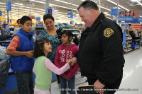 A young lady thanks Officer Barrett for everything the police union did for her and her family