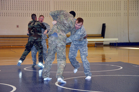 Students in the combatives level one class with the 7th Squadron, 17th Cavalry Regiment, practice moves in order to take down their opponent during a combatives level one course Dec. 12th at Fort Campbell, KY.  (U.S. Army photo by Sgt. Shanika L. Futrell, 159th Combat Aviation Brigade Public Affairs)