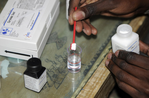 U.S. Army Pfc. Demetrius Roberson, a preventive medicine medic with Company C, 426th Brigade Supoprt Battalion, 1st Brigade Combat Team, 101st Airborne Division, adds CN-1 to a small beaker of water to test for cyanide in the sample Dec. 17th, 2012, on Forward Operating Base Fenty, Afghanistan. (U.S. Army photo by Sgt. Jon Heinrich, Task Force 1-101 PAO).