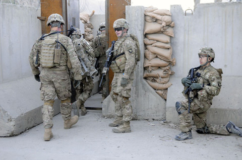 Soldiers from 3rd Platoon, Company D, 1st Battalion, 327th Infantry Regiment, 1st Brigade Combat Team, 101st Airborne Division, move into the Afghan Customs Department at Torkham Gate Dec. 20th. The gate lies on the border of Afghanistan and Pakistan and is monitored by the Afghan Customs Police, Afghan Border Police and the National Directorate of Security. (U.S. Army photo by Sgt. Jon Heinrich, Task Force 1-101 PAO)