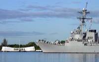 Sailors man the rail of the USS Hopper (DDG 70) as it passes by the USS Arizona Memorial in Pearl Harbor, Hawaii, on Dec. 7, 2000. (SSG. Paul Holcomb/U.S. Air Force)