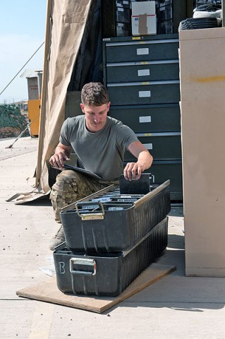 Pvt. Jesse Ingram, D Company 1st Battalion, 101st Combat Aviation Brigade, Task Force No Mercy, AH-64 Apache mechanic, a native of Kendalia, Texas, inventories and sorts parts at a maintenance hangar at Forward Operating Base Salerno, Afghanistan, October 18th, 2012. (published in Why We Serve: Pvt. Jesse Ingram by rceast)