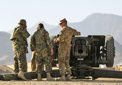 Master Sgt. Liviu Ivan (right), the D-30 Howitzer subject matter expert assigned to 3rd Battalion 320th Field Artillery Regiment, 3rd Brigade Combat Team "Rakkasans," 101st Airborne Division (Air Assault), helps soldiers with the Afghan National Army's 203rd Corps, 1st Infantry Brigade, 4th Kandak, D-30 Heavy Coy, check the gun systems before firing at Camp Parsa, Afghanistan, Jan. 9, 2013.  (U.S. Army photo by Spc. Brian Smith-Dutton, Task Force 3/101 Public Affairs)