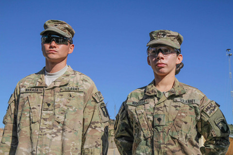 U.S. Army Sgt. Lizeth Wakasa (right), a food service specialist assigned to Headquarters Company, 3rd Battalion, 187th Infantry Regiment, 3rd Brigade Combat Team “Rakkasans,” 101st Airborne Division (Air Assault), stands proud before her promotion to sergeant with her husband U.S. Army Spc. David Wakasa (left), also a food service specialist with Headquarters, 3-187, at Combat Outpost Bowri Tana, Dec. 1st, 2012.  (U.S. Army photo by Sgt. 1st Class Abram Pinnington, Task Force 3/101 Public Affairs)