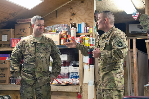 First Sgt. Bryan Kipp, B Company, 6th Battalion, 101st Combat Aviation Brigade, catches up with Staff Sgt. Christopher Salmond, B, 6-101 CAB platoon sergeant during battlefield circulation at Forward Operating Base Fenty, Afghanistan Dec. 22nd, 2012. First sergeants use battlefield circulations to make sure that their soldiers have everything they need when companies are split between different task forces. (U.S. Army photo by Sgt. Duncan Brennan, 101st CAB public affairs)