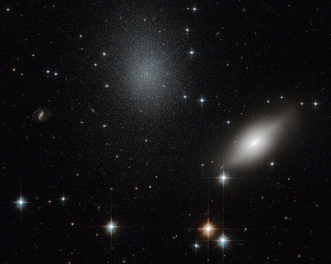 This image of galaxies NGC 5011B and NGC 5011C in the Constellation of Centaurus was taken with Hubble’s Advanced Camera for Surveys using visual and infrared filters. (ESA/Hubble & NASA)