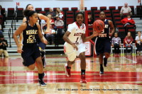 Tiasha Gray of the APSU Lady Gov’s drives the ball up against a tough Murray State Racer Defense