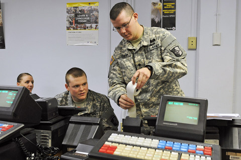 Spc. Nathaniel W. Harp, a human resource specialist with 2nd Platoon, 101st Human Resource Company, 101st Sustainment Brigade "LifeLiners," inserts receipt paper into the Intergrated Retail Terminal machine during a Postal Operations course at Fort Campbell, KY, Dec. 12th, 2012. The Postal Operations course trains the soldiers on how to operate a post office while deployed or overseas. (Photo by Sgt. Sinthia Rosario)