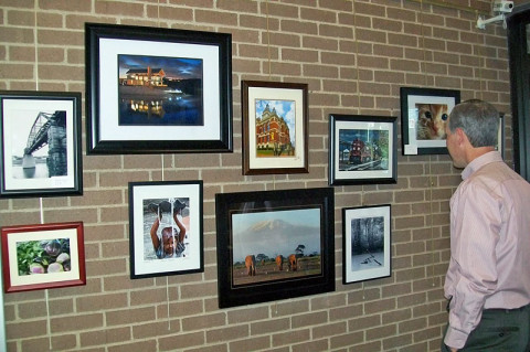 An exhibit by the Clarksville Friends of Photography. The large photo with elephants is by Bob Gandy in Kenya.