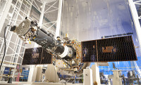 The fully integrated spacecraft and science instrument for NASA’s Interface Region Imaging Spectrograph (IRIS) mission is seen in a clean room at the Lockheed Martin Space Systems Sunnyvale, CA facility. The solar arrays are deployed in the configuration they will assume when in orbit. (Credit: Lockheed Martin)