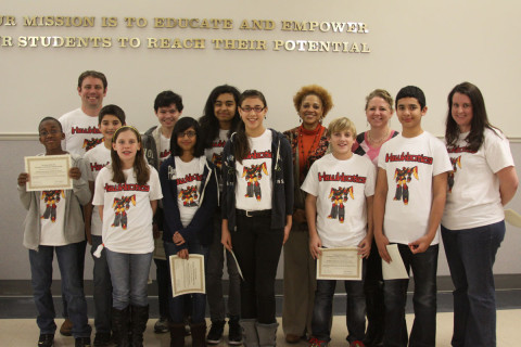 Rossview Middle School's Hawktronics Robotics Team with coaches Jason Pierschbacher and Bridget Harding and Assistant Principal Rosalyn Williams.